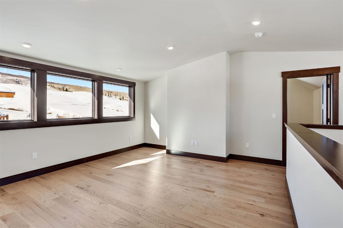 62 Vendette Road Silverthorne, CO 80498 - Photo 14 of 35 a view of an empty room with wooden floor and a window