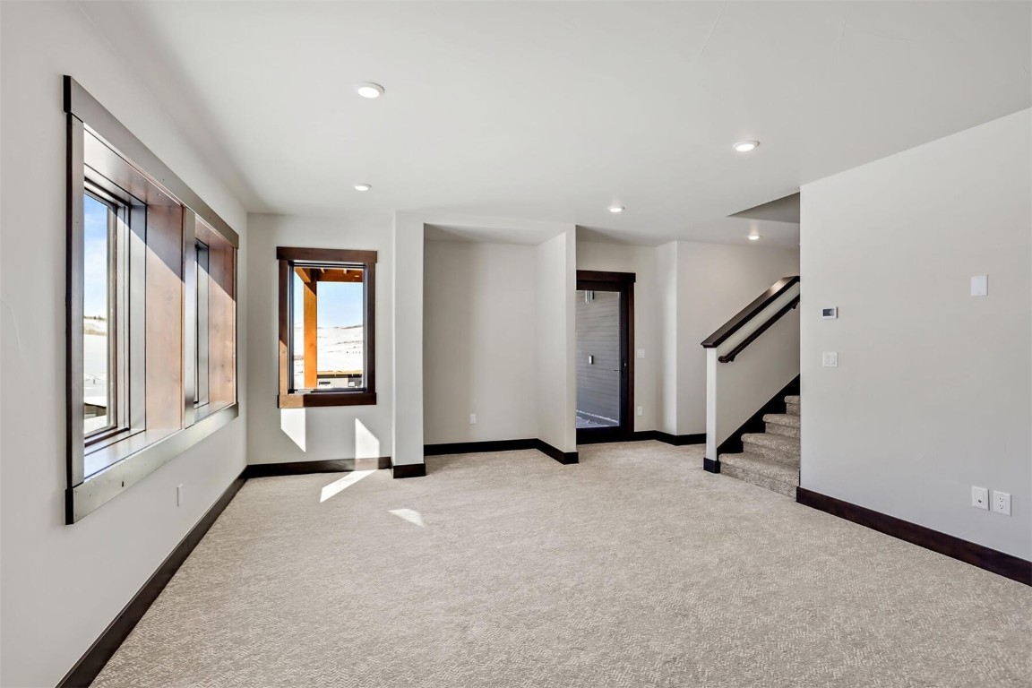 62 Vendette Road Silverthorne, CO 80498 - Photo 19 of 35 a view of an empty room with a fireplace and a window