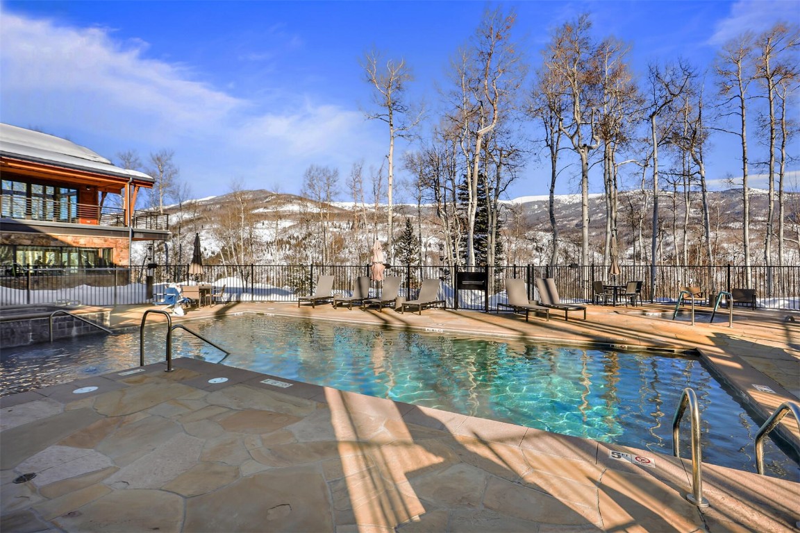 62 Vendette Road Silverthorne, CO 80498 - Photo 32 of 35 a view of swimming pool with outdoor seating and city view
