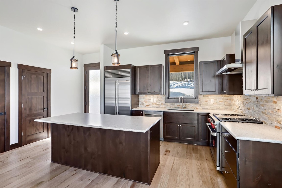 62 Vendette Road Silverthorne, CO 80498 - Photo 5 of 35 a kitchen with stainless steel appliances granite countertop a sink a stove and a refrigerator