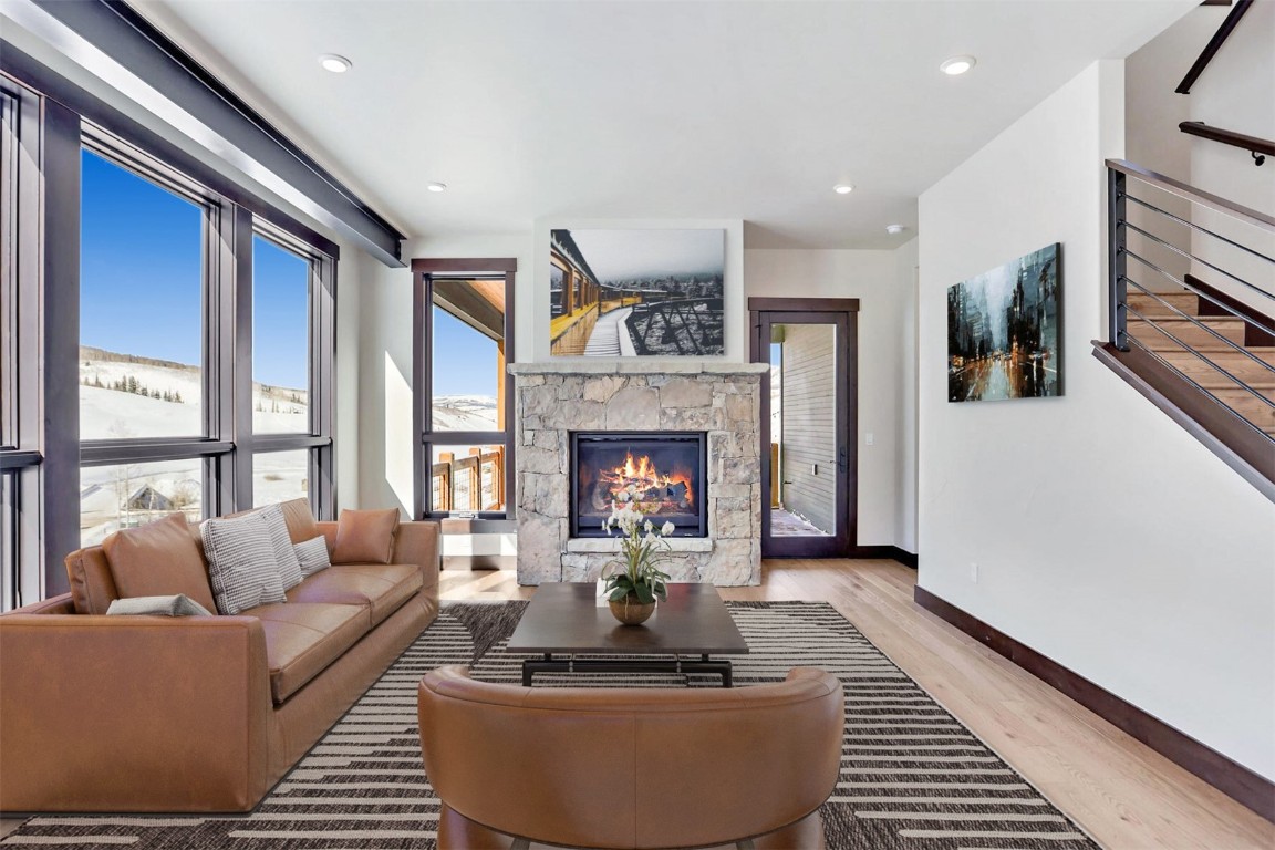 62 Vendette Road Silverthorne, CO 80498 - Photo 9 of 35 a living room with furniture a window and a fireplace