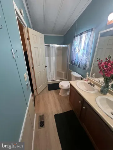 a bathroom with a sink vanity and a mirror