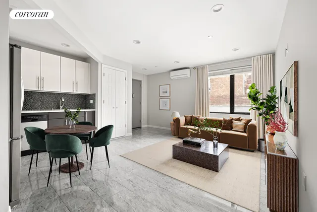 a living room with furniture a dining table and a potted plant