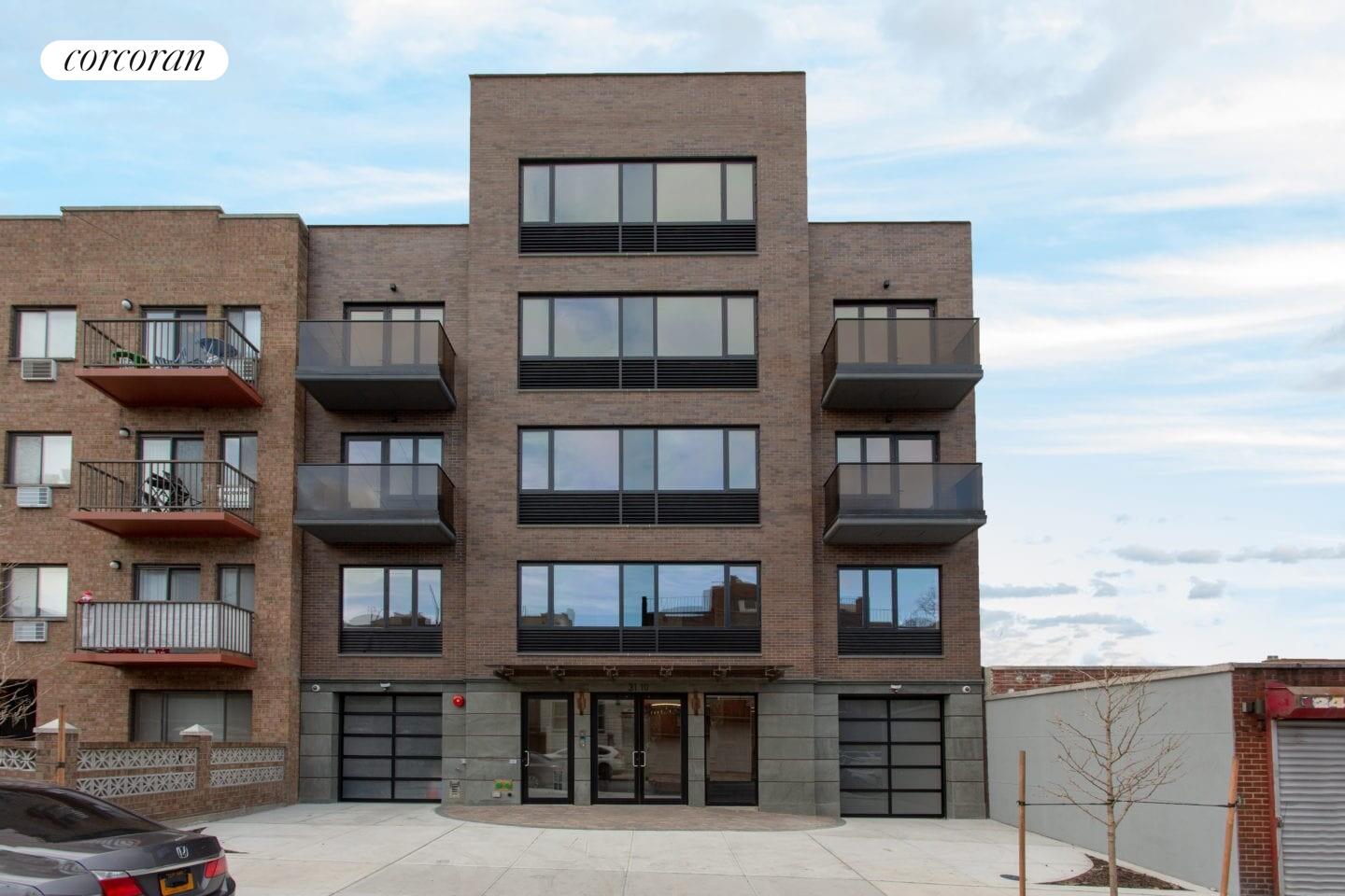 31-10 28th Road, Unit A1 Queens, NY 11102 - Photo 9 of 10 a front view of a building with glass windows