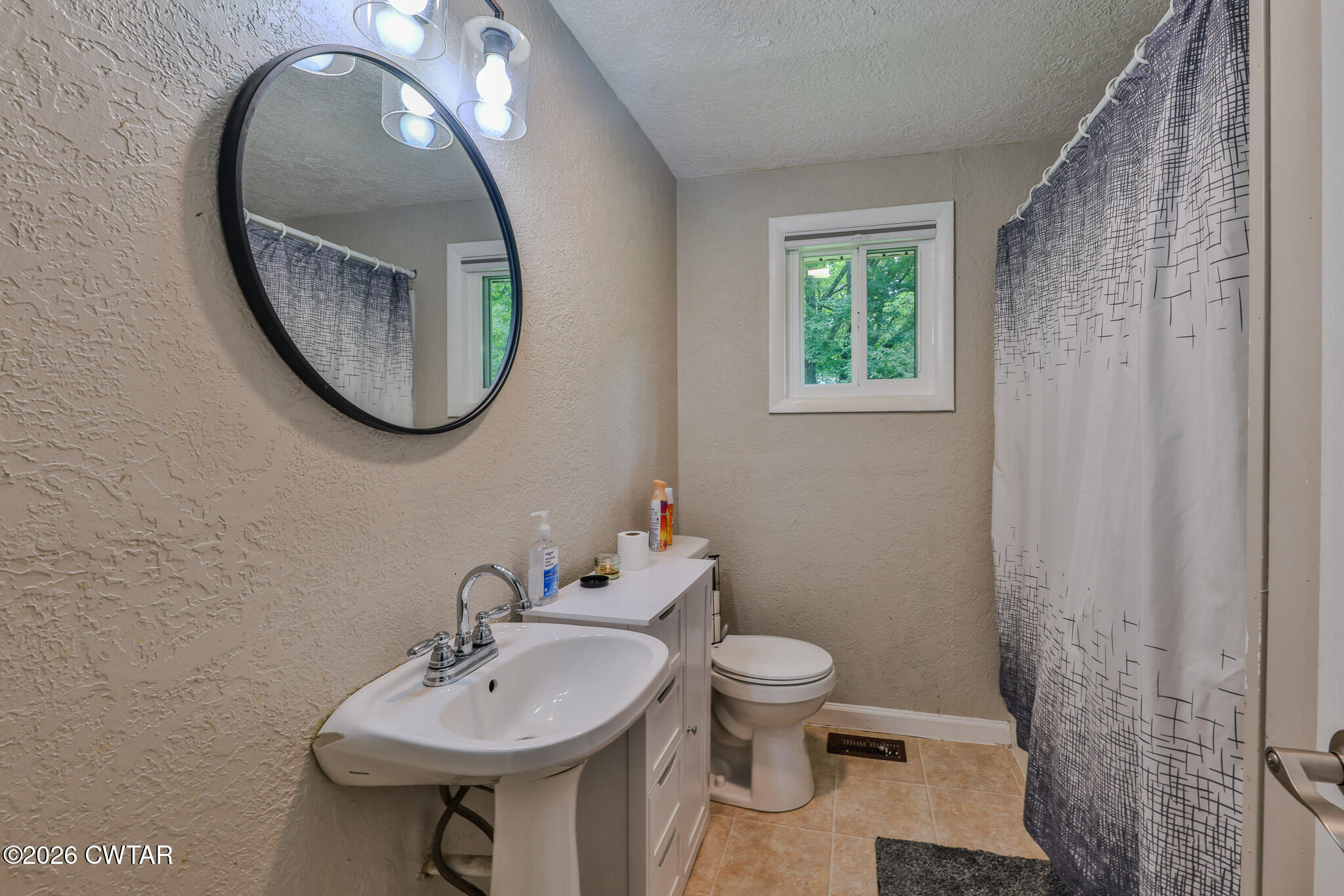 25 Shady Lane Huntingdon, TN 38344 - Photo 11 of 16 a bathroom with a sink and a mirror