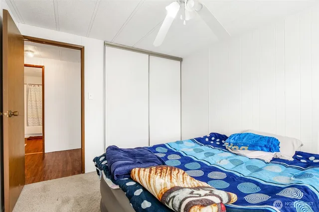 a bedroom with a bed and a dresser