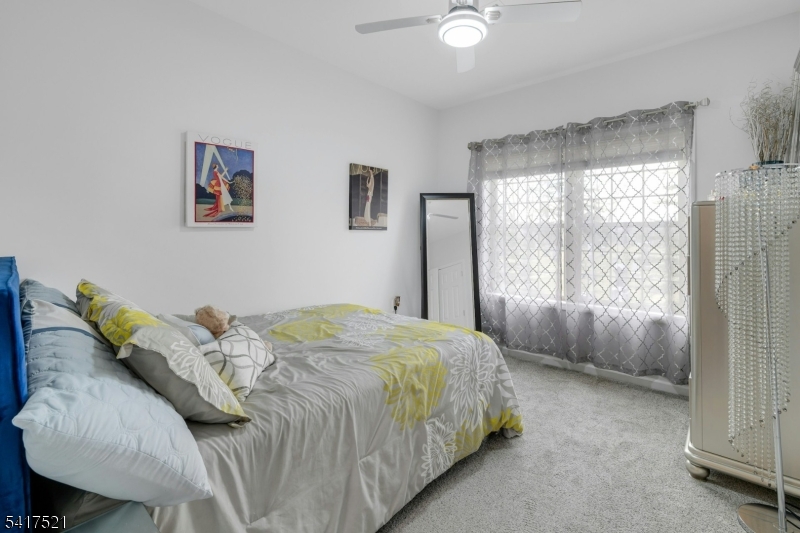 16 Main Street, Unit D6 Sparta, NJ 07871 - Photo 20 of 37 a bedroom with a bed and a window