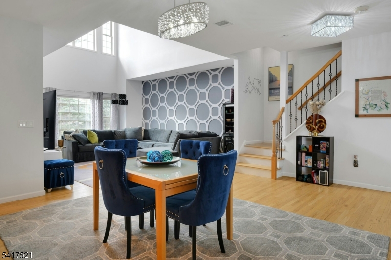 16 Main Street, Unit D6 Sparta, NJ 07871 - Photo 10 of 37 a view of a dining room with furniture and chandelier