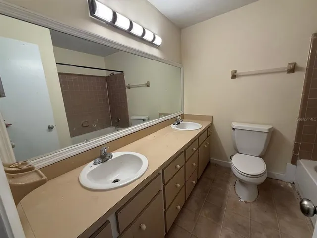 a view of an empty room and a window