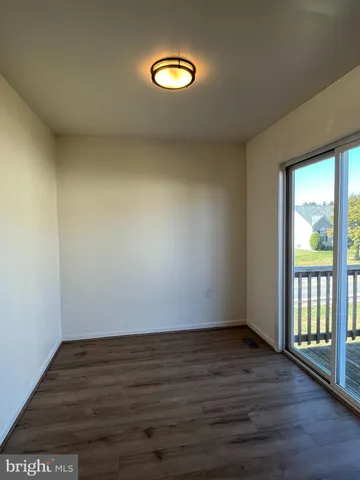 a view of balcony with wooden floor
