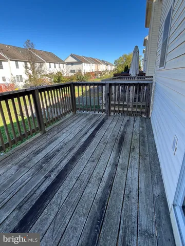 a view of wooden balcony with wooden floor and fence