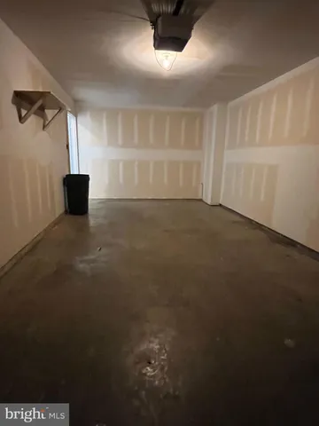 a view of a livingroom with an empty space and a window