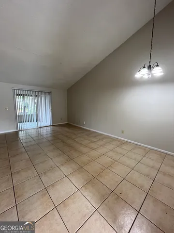 a view of an empty room and a window