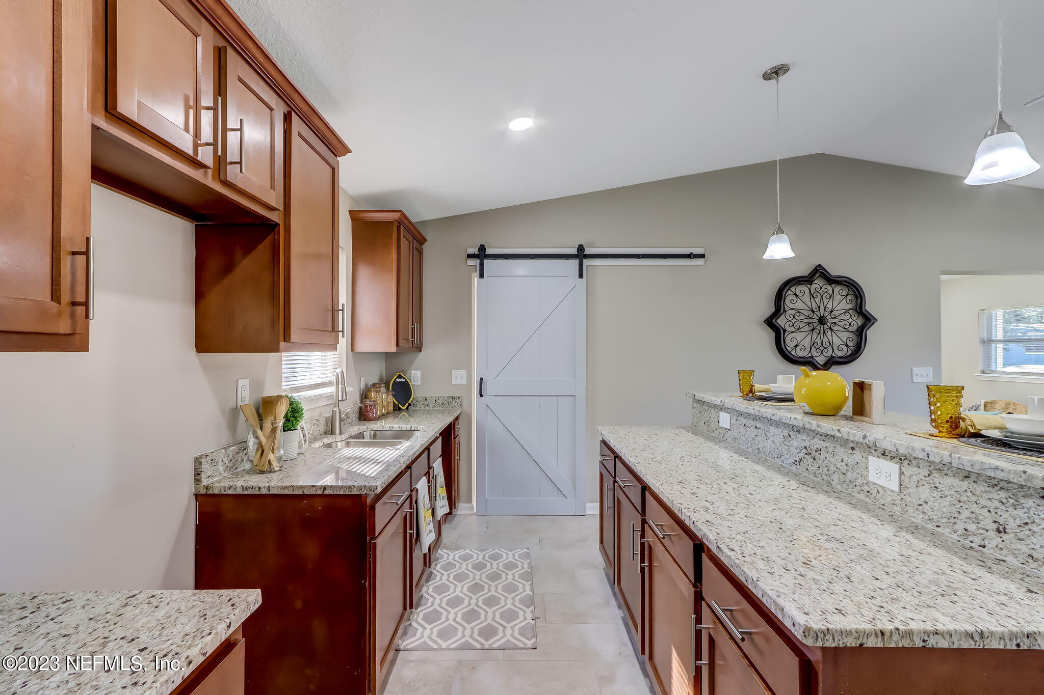 8545 Laurens Road Jacksonville, FL 32208 - Photo 11 of 29 a kitchen with stainless steel appliances granite countertop a sink a stove and a wooden floors