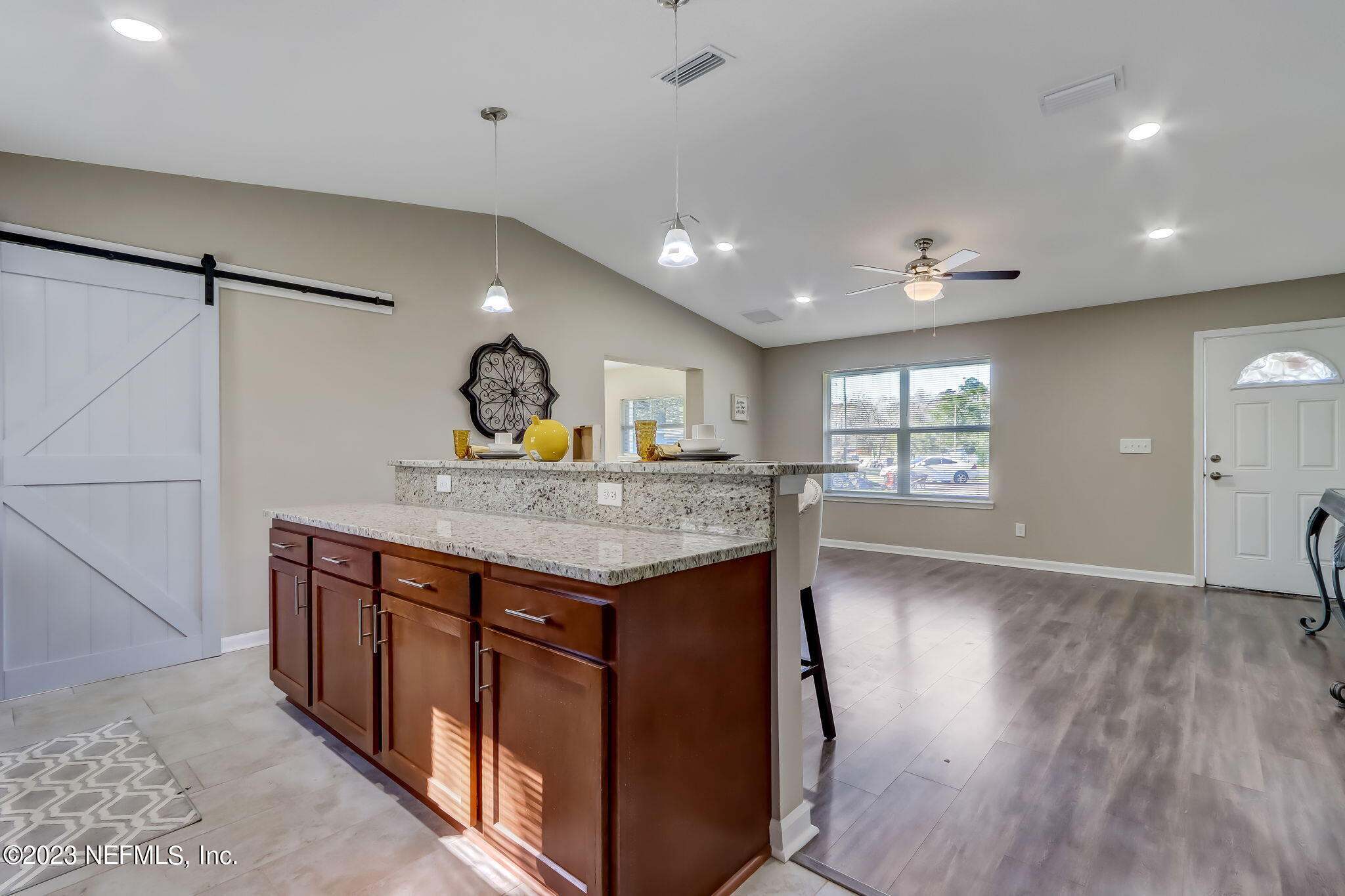 8545 Laurens Road Jacksonville, FL 32208 - Photo 29 of 29 a kitchen with granite countertop a stove and a wooden floors