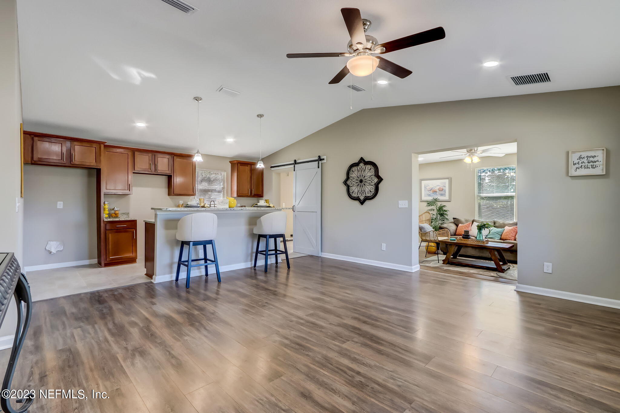 8545 Laurens Road Jacksonville, FL 32208 - Photo 12 of 29 a view of kitchen with stainless steel appliances refrigerator stove dining table and chairs