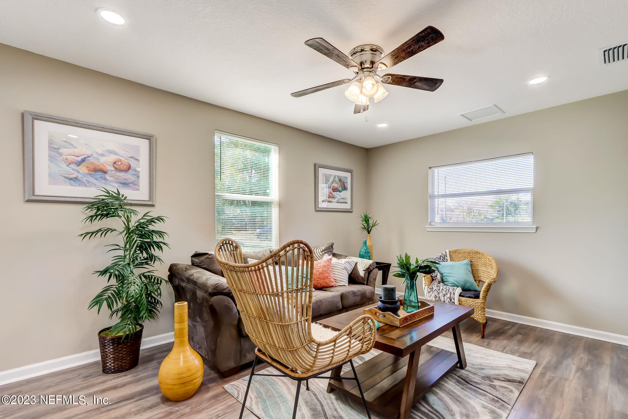 8545 Laurens Road Jacksonville, FL 32208 - Photo 14 of 29 a living room with furniture and potted plant