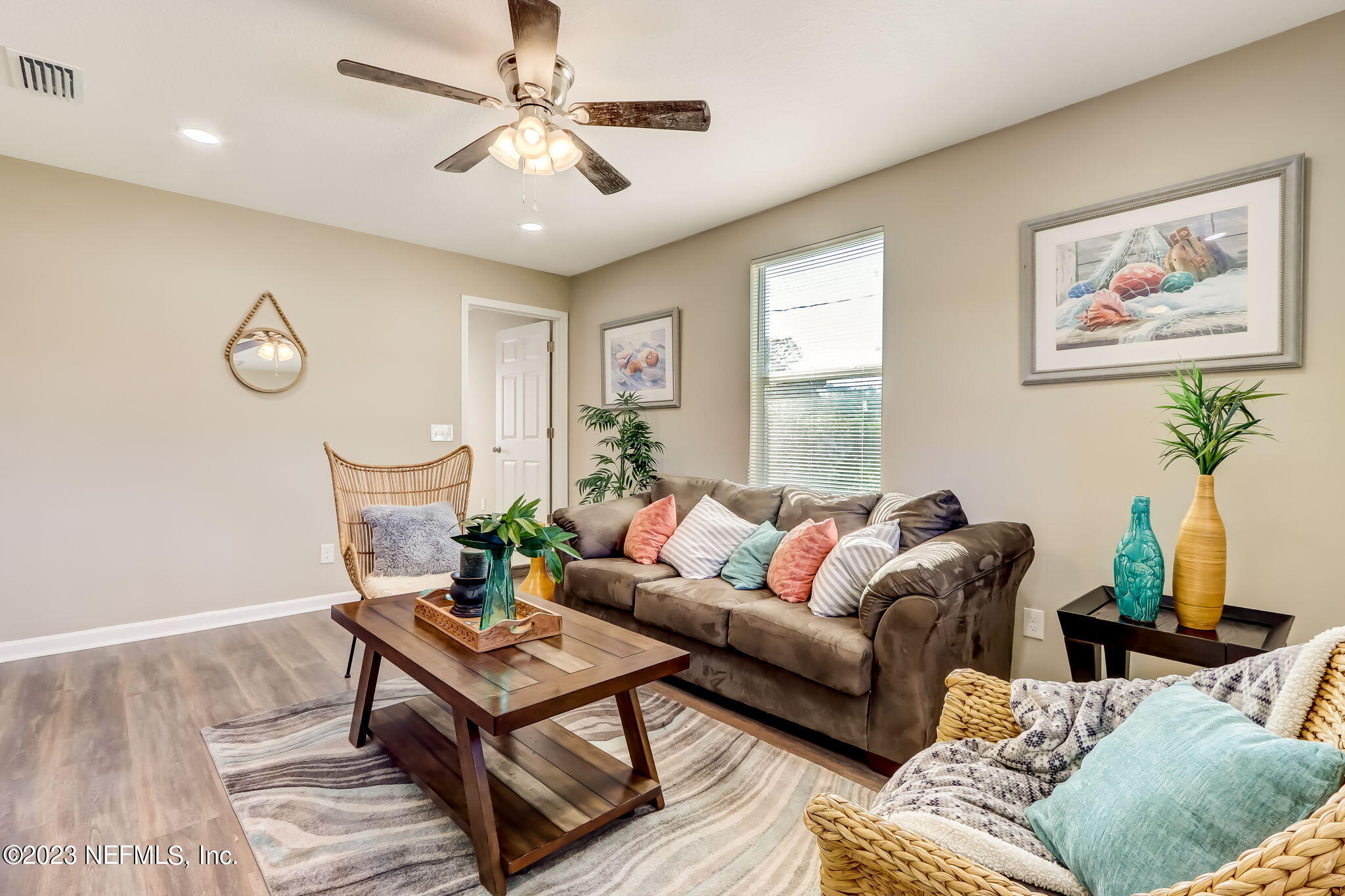 8545 Laurens Road Jacksonville, FL 32208 - Photo 15 of 29 a living room with furniture a table and a potted plant