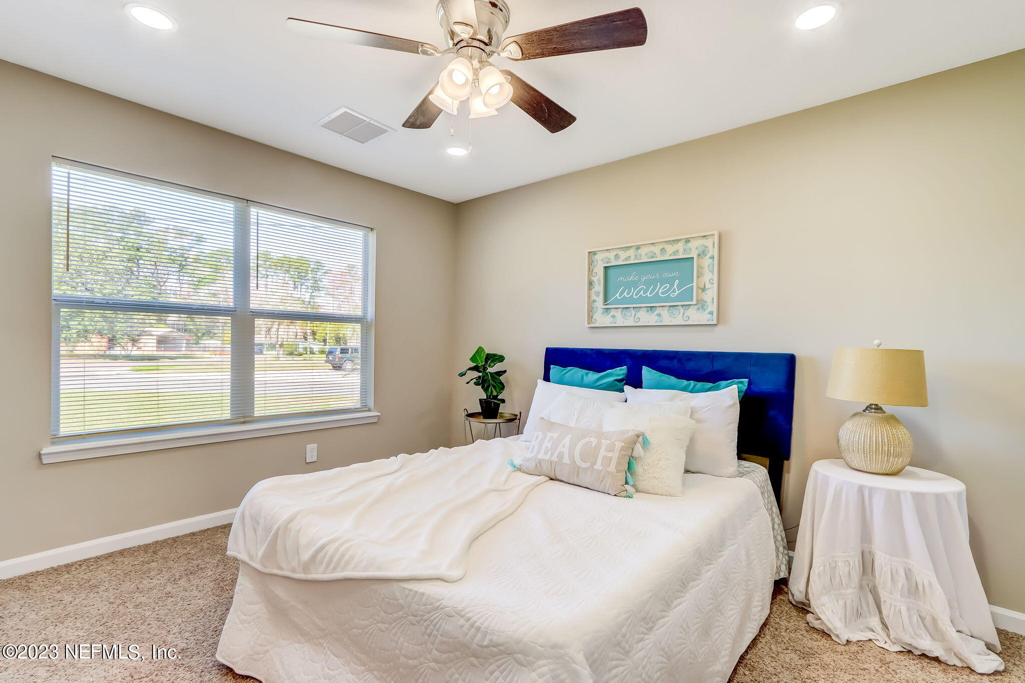 8545 Laurens Road Jacksonville, FL 32208 - Photo 16 of 29 a bedroom with a large bed and a window