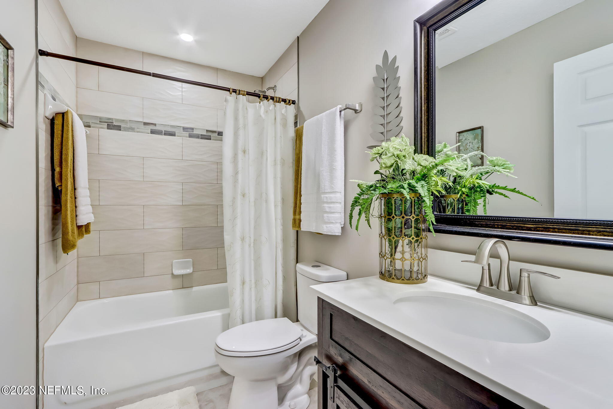 8545 Laurens Road Jacksonville, FL 32208 - Photo 20 of 29 a bathroom with a sink toilet and shower