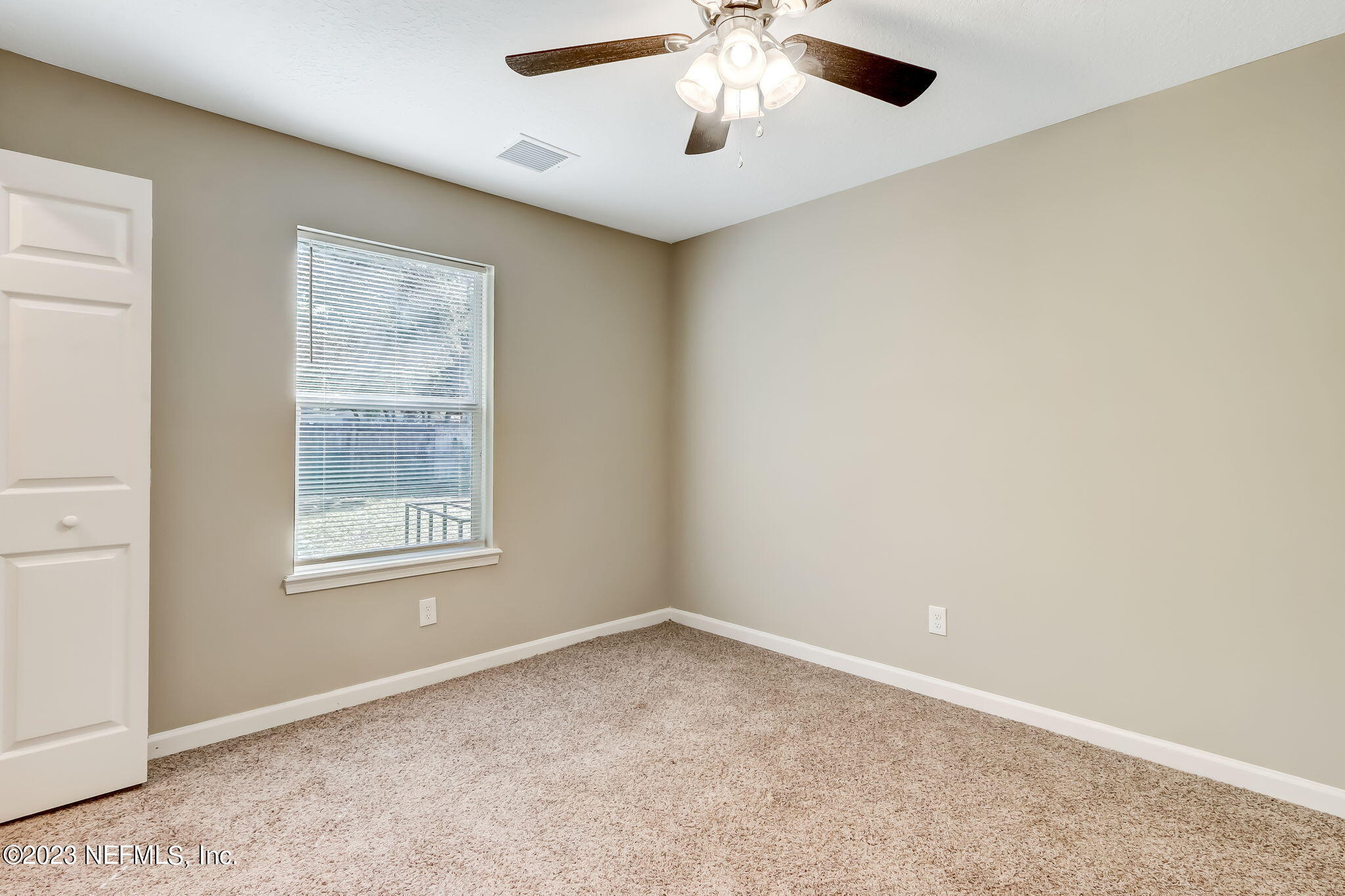 8545 Laurens Road Jacksonville, FL 32208 - Photo 23 of 29 an empty room with a window