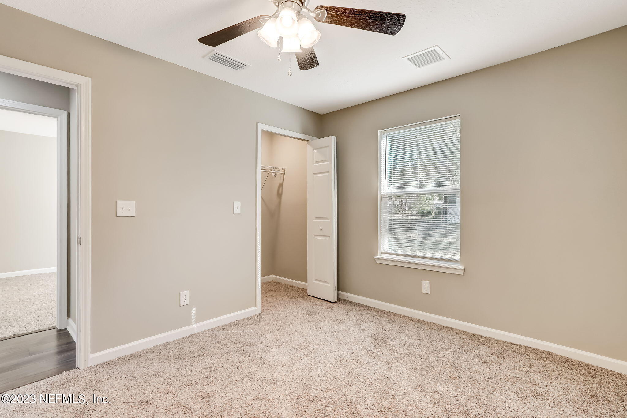 8545 Laurens Road Jacksonville, FL 32208 - Photo 24 of 29 an empty room with windows and closet