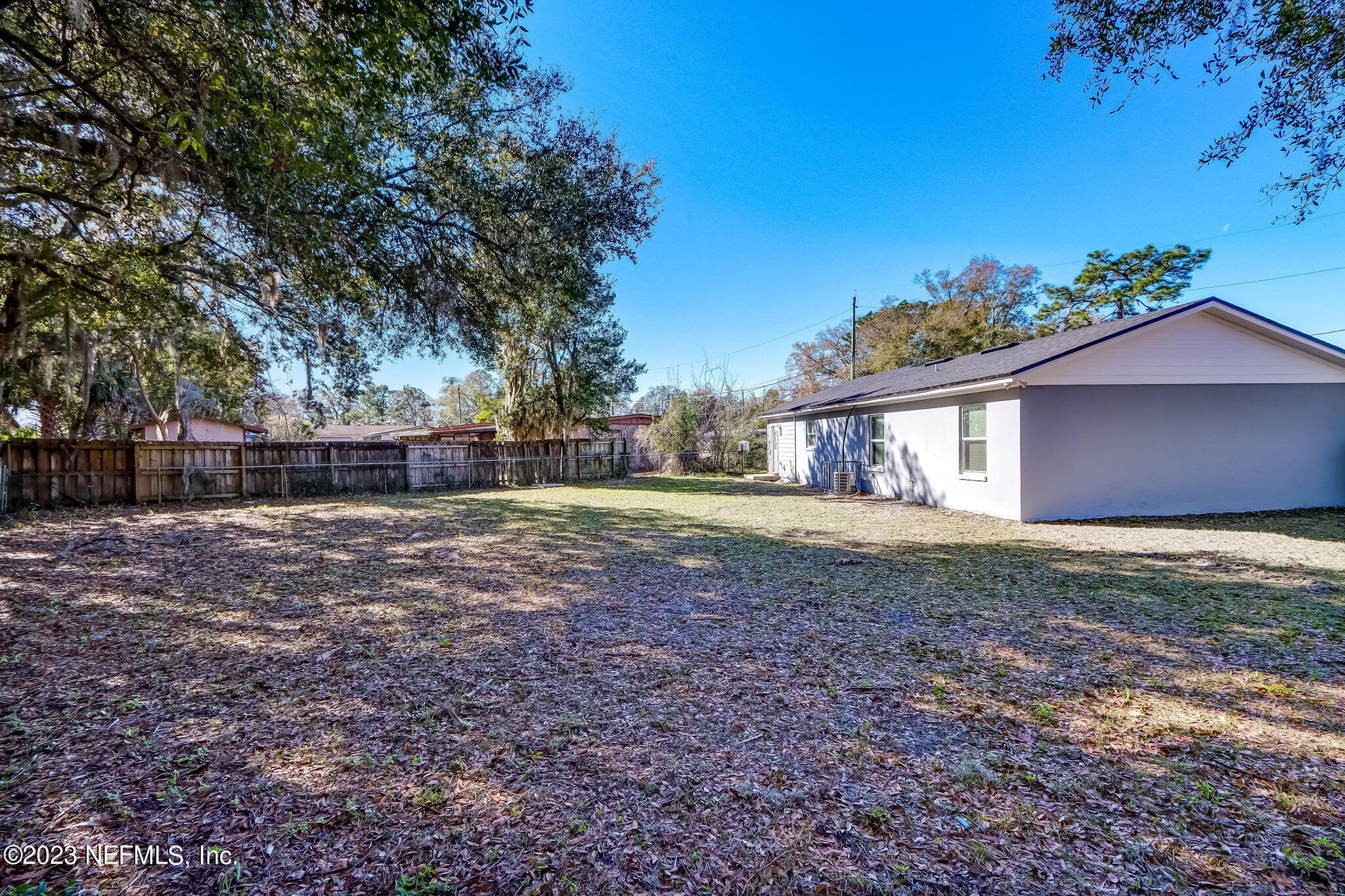 8545 Laurens Road Jacksonville, FL 32208 - Photo 26 of 29 a view of a house with yard and a garden