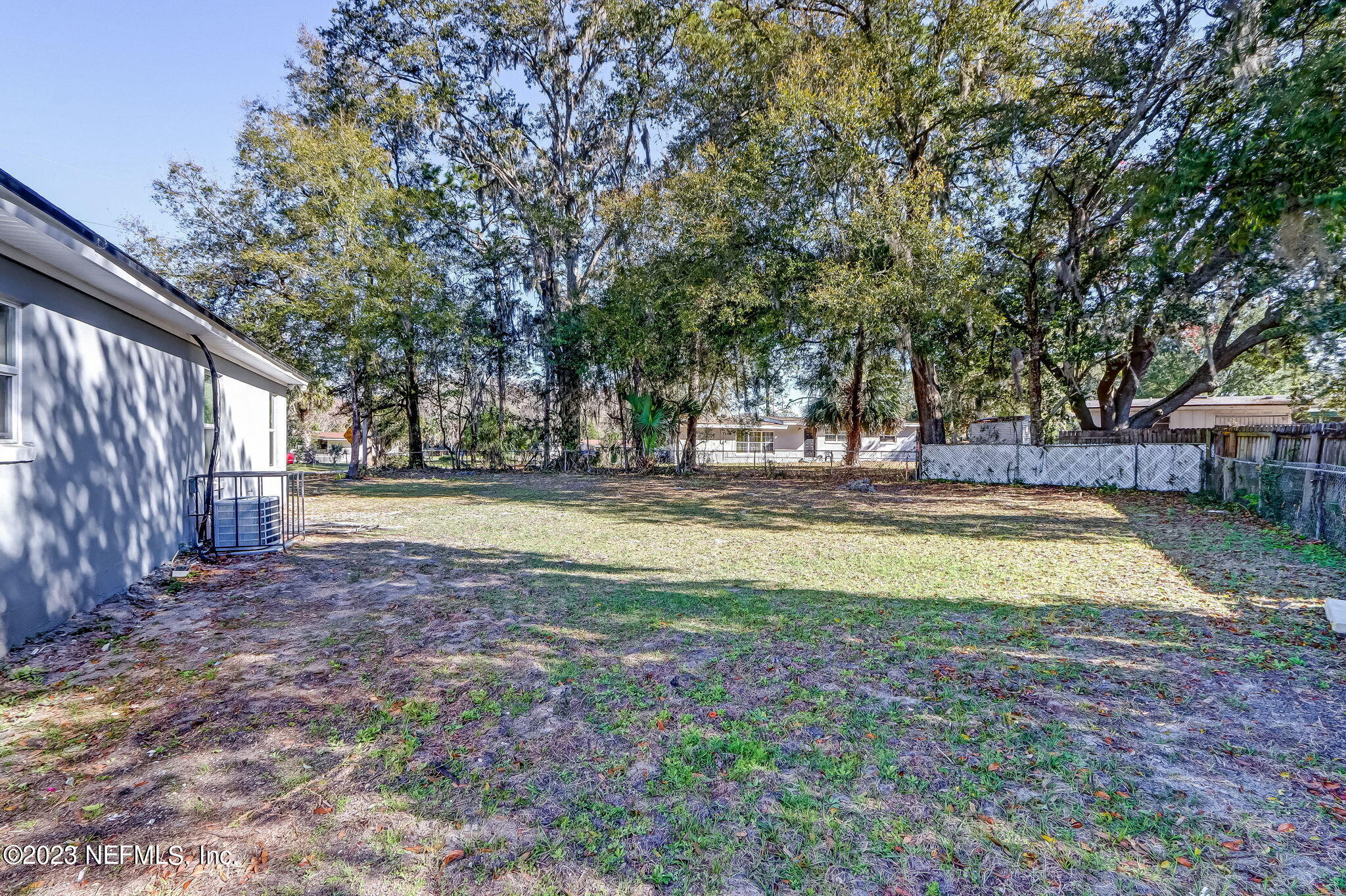 8545 Laurens Road Jacksonville, FL 32208 - Photo 28 of 29 a view of yard with swimming pool and large trees