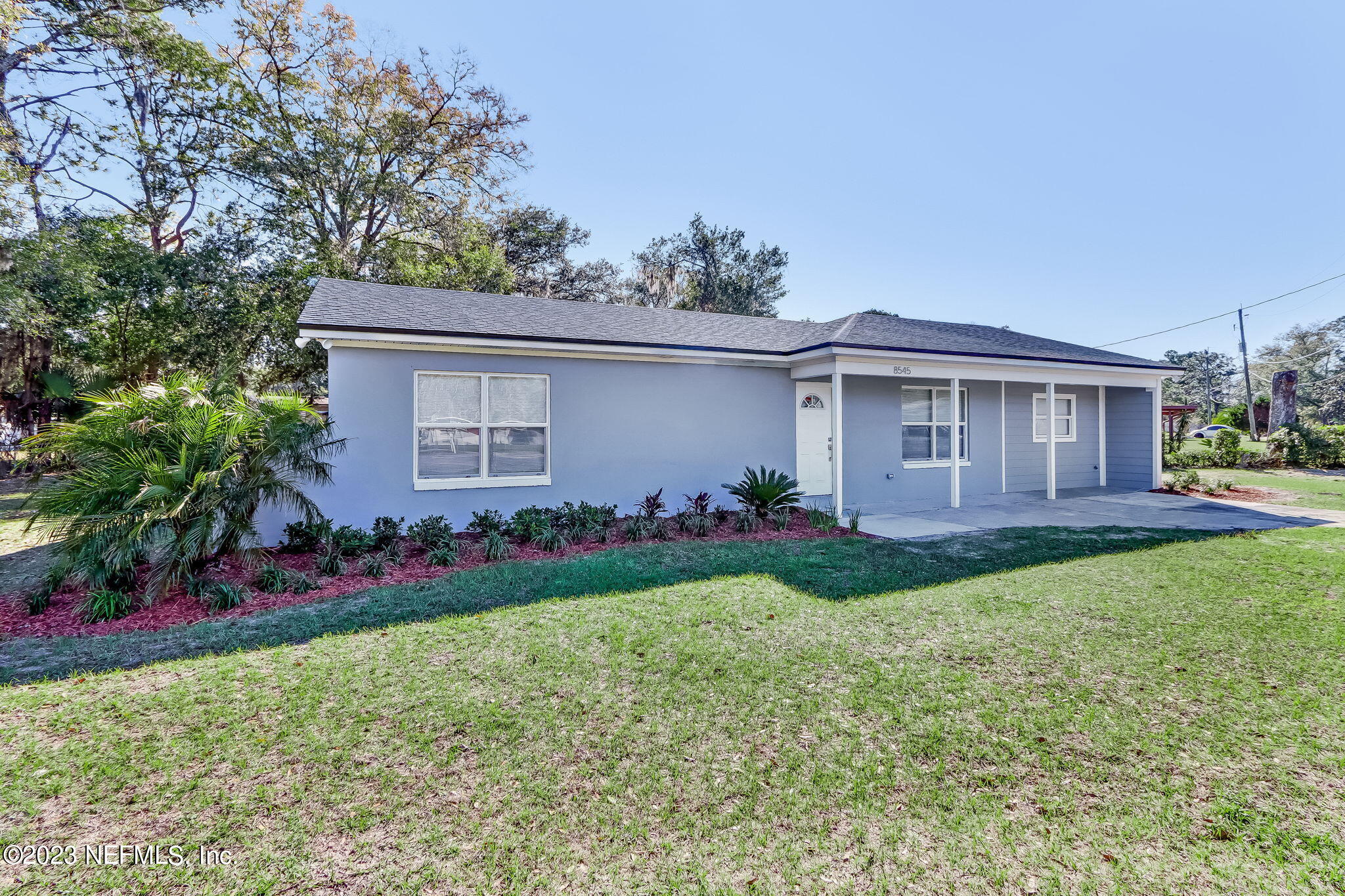 8545 Laurens Road Jacksonville, FL 32208 - Photo 3 of 29 a view of an house with backyard space and garden
