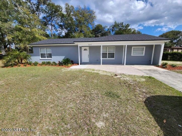 8545 Laurens Road Jacksonville, FL 32208 - Photo 4 of 29 front view of a house with a yard