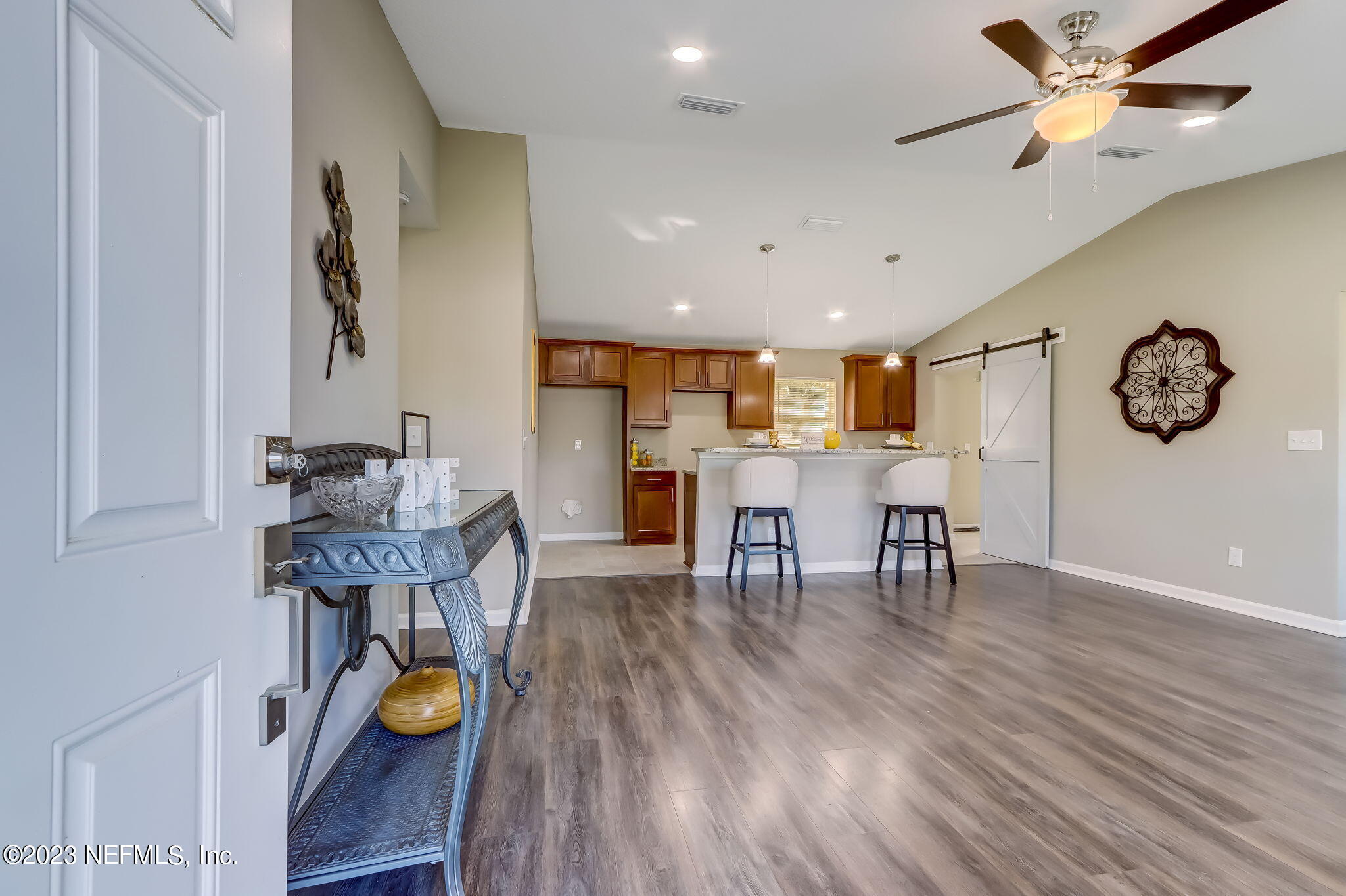 8545 Laurens Road Jacksonville, FL 32208 - Photo 6 of 29 a view of a dining room with furniture and wooden floor