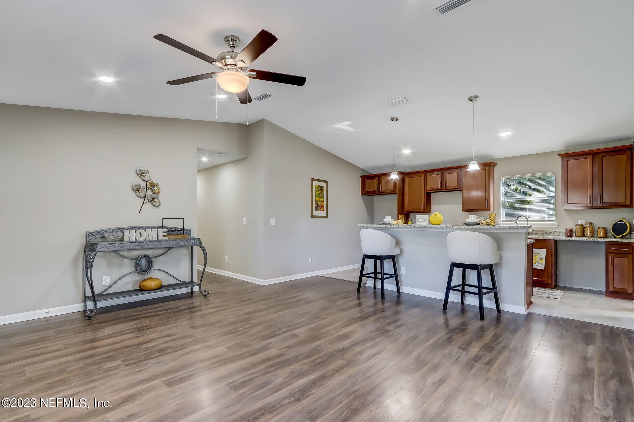 8545 Laurens Road Jacksonville, FL 32208 - Photo 7 of 29 a living room with furniture and kitchen view