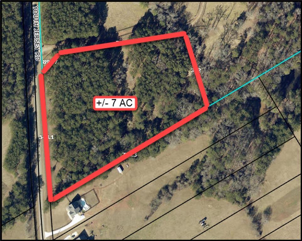 7-ac Youth Jersey Road Covington, GA 30014 - Photo 2 of 34 a close up of a street sign