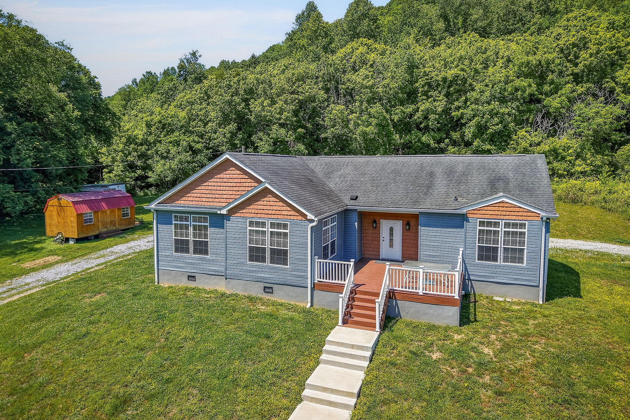 16062 Buffalo Valley Road Silver Point, TN 38582 - Photo 1 of 27 a house view with a garden space
