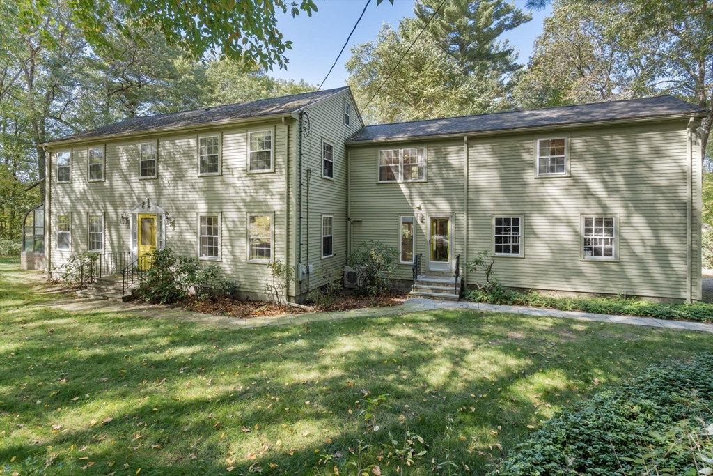 a view of a back yard of the house