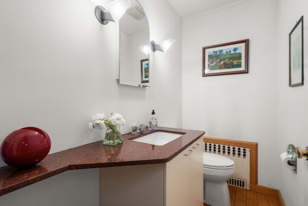 60 Possum Road Weston, MA 02493 - Photo 11 of 21 a bathroom with a toilet a sink and mirror