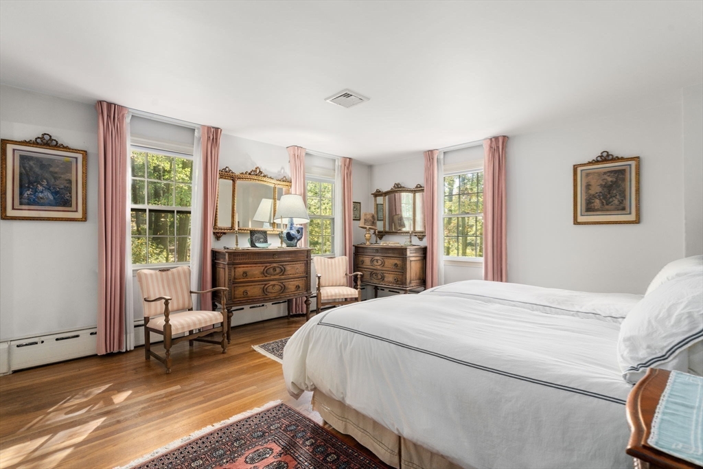 60 Possum Road Weston, MA 02493 - Photo 14 of 21 a bedroom with a bed and wooden floor