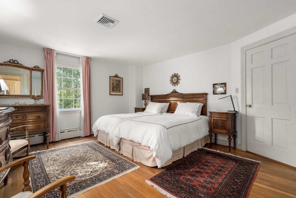 60 Possum Road Weston, MA 02493 - Photo 15 of 21 a bedroom with a bed and a fireplace