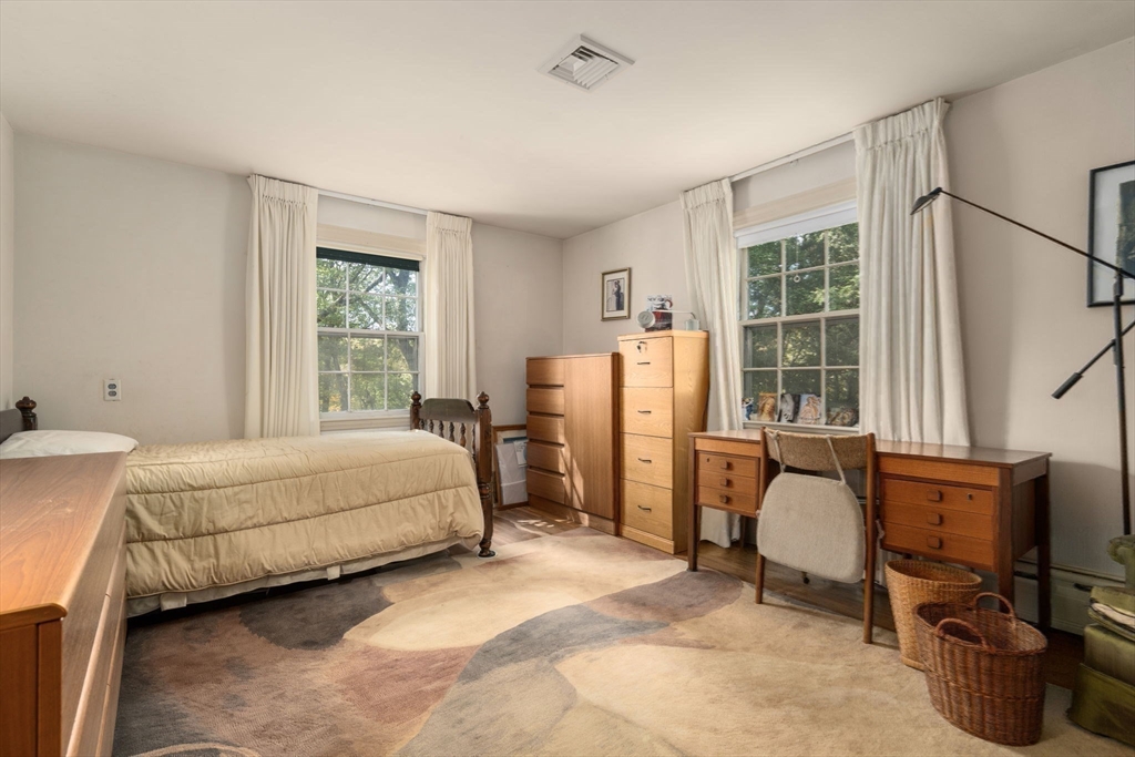 60 Possum Road Weston, MA 02493 - Photo 17 of 21 a bed room with a bed and a chair