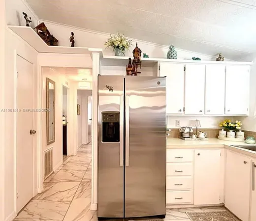 a kitchen with a refrigerator and countertop