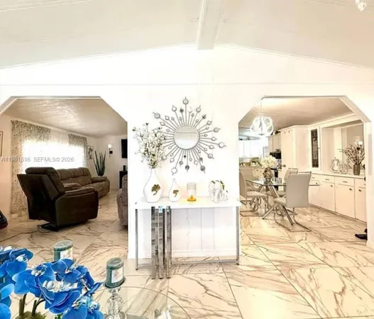 a living room with furniture and a mirror