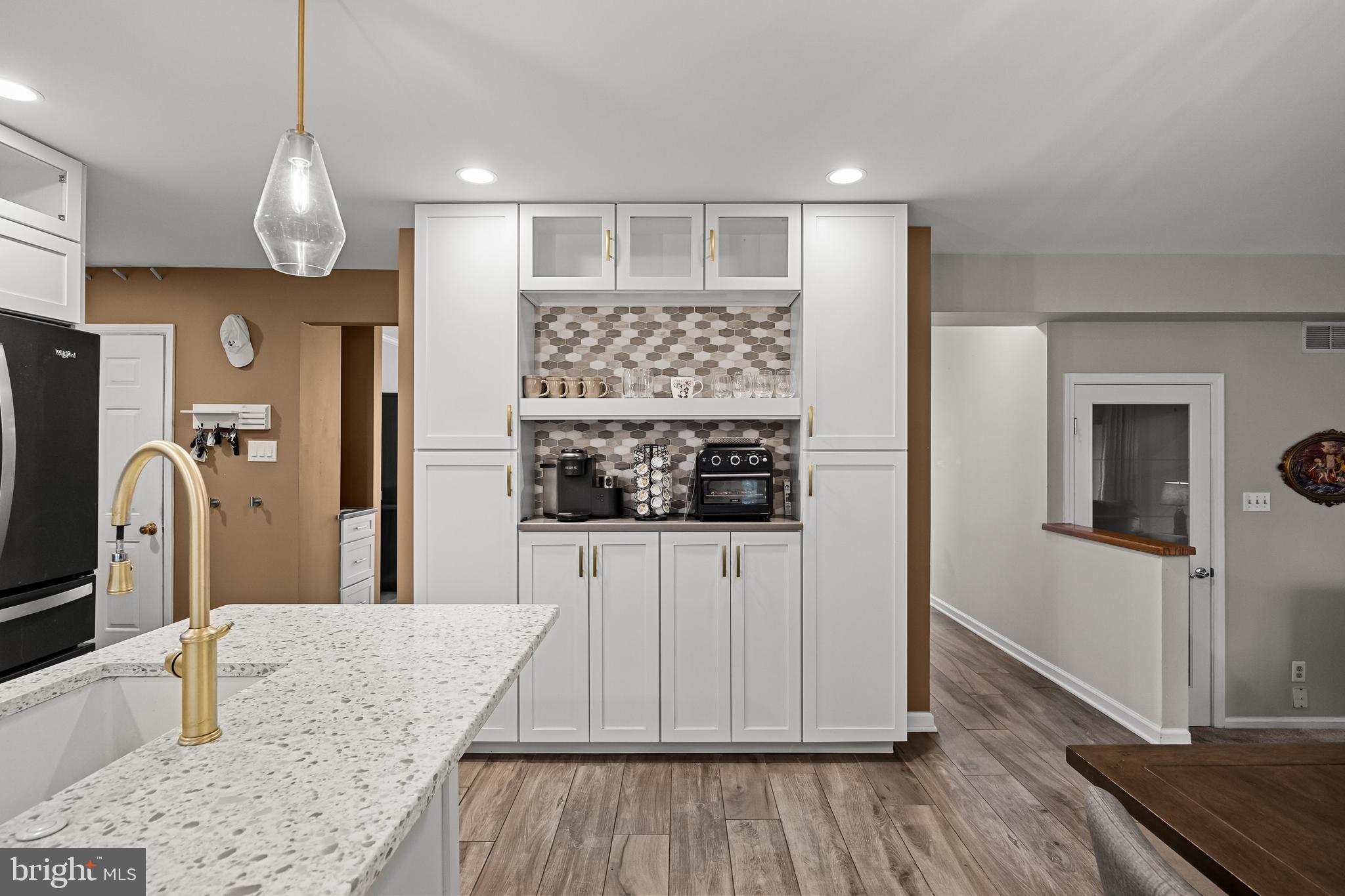 4 Mill Run Court Medford, NJ 08055 - Photo 11 of 53 a kitchen with stainless steel appliances granite countertop a refrigerator a sink and wooden floors
