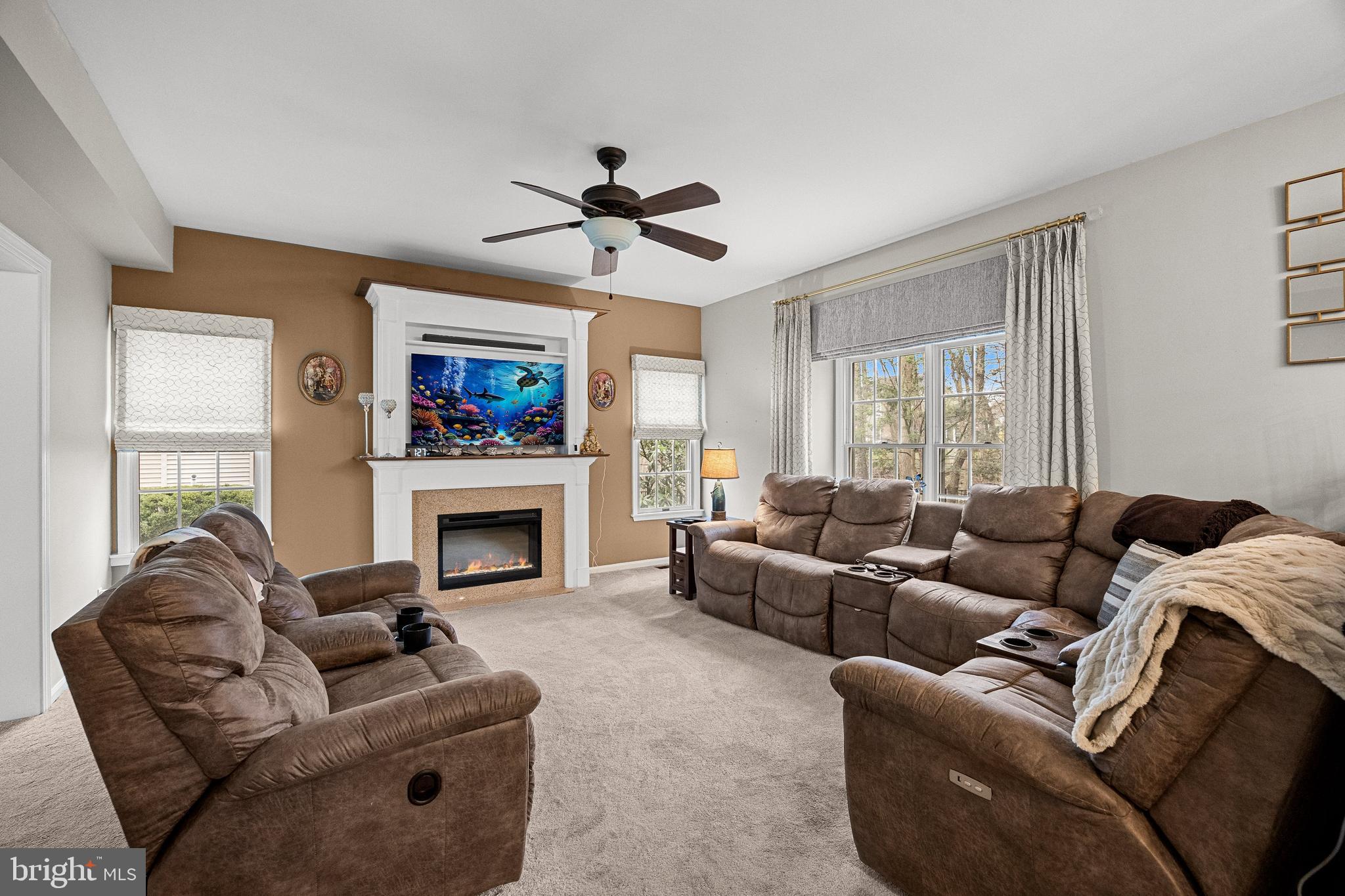 4 Mill Run Court Medford, NJ 08055 - Photo 14 of 53 a living room with furniture a window and a fireplace