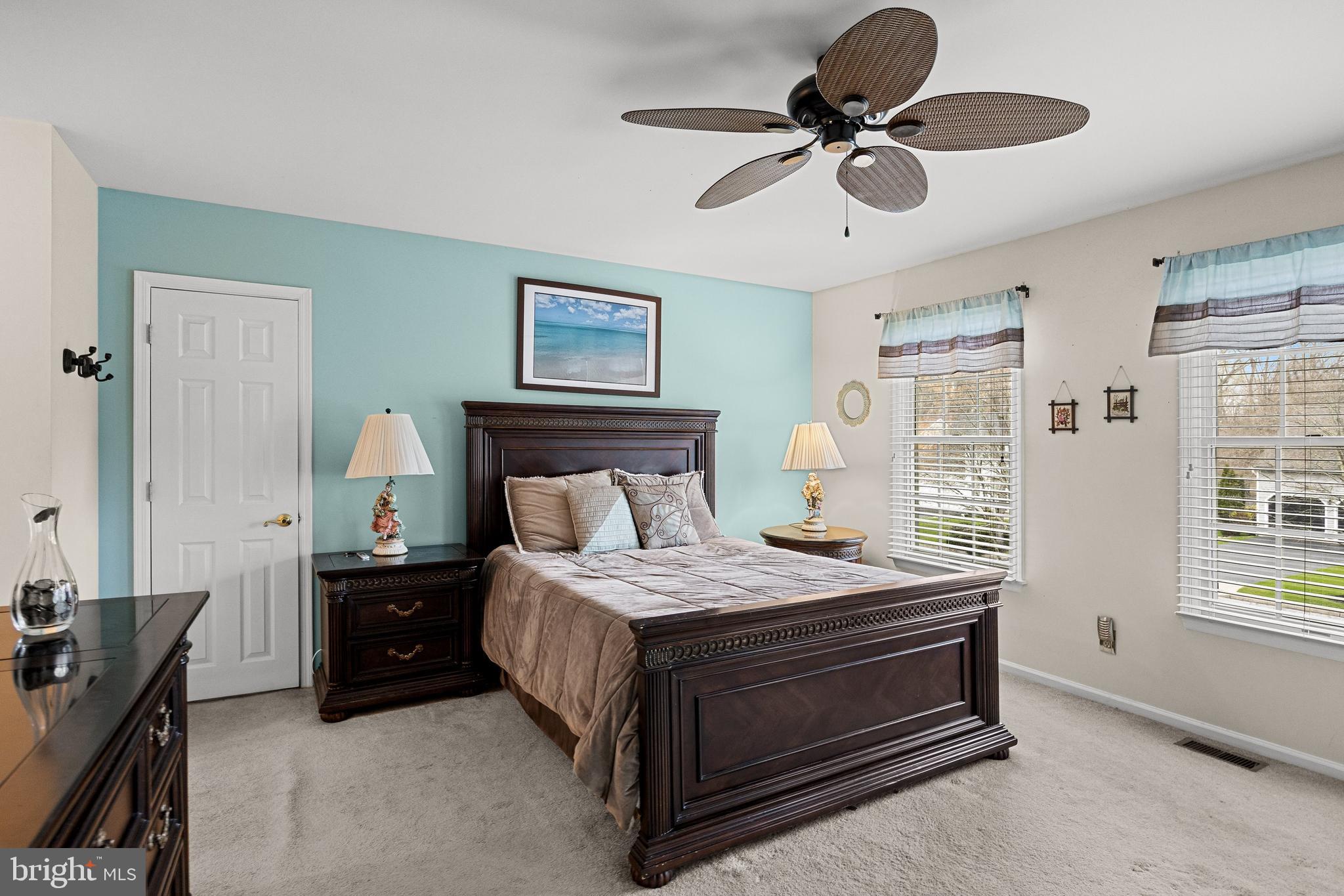 4 Mill Run Court Medford, NJ 08055 - Photo 18 of 53 a bedroom with a bed and a chandelier