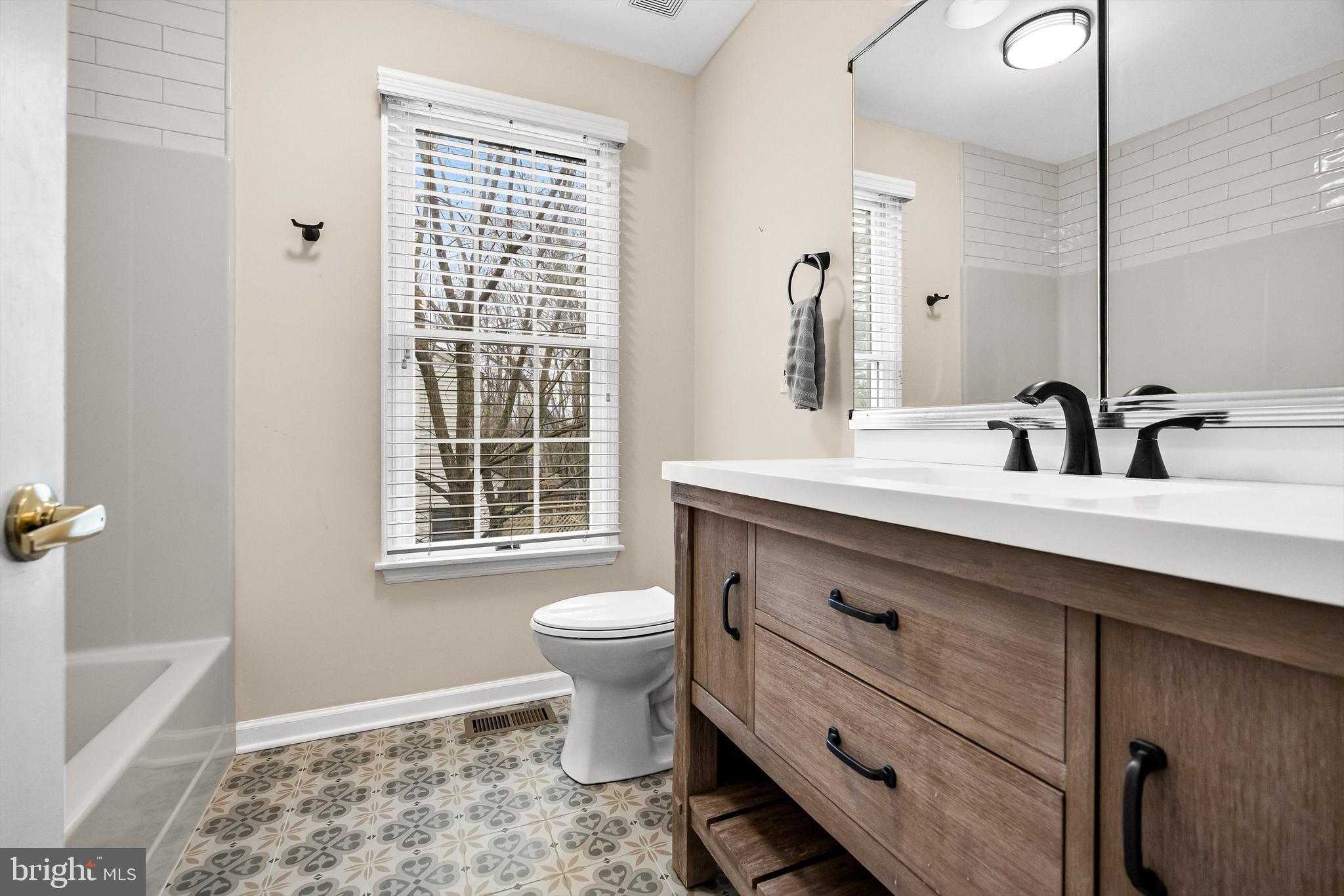 4 Mill Run Court Medford, NJ 08055 - Photo 28 of 53 a bathroom with a double vanity sink a toilet and a mirror