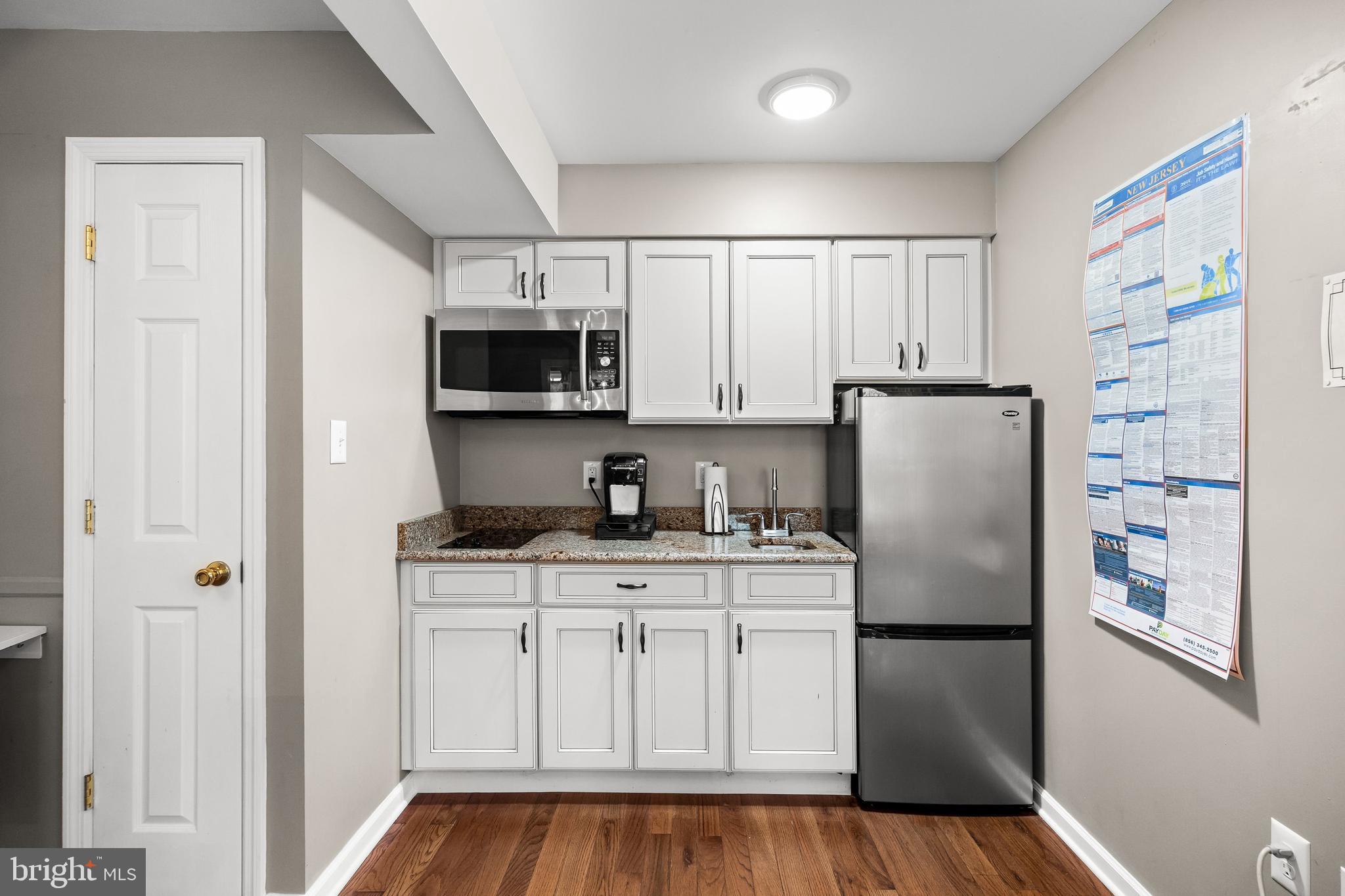 4 Mill Run Court Medford, NJ 08055 - Photo 37 of 53 a kitchen with a refrigerator a microwave and cabinets