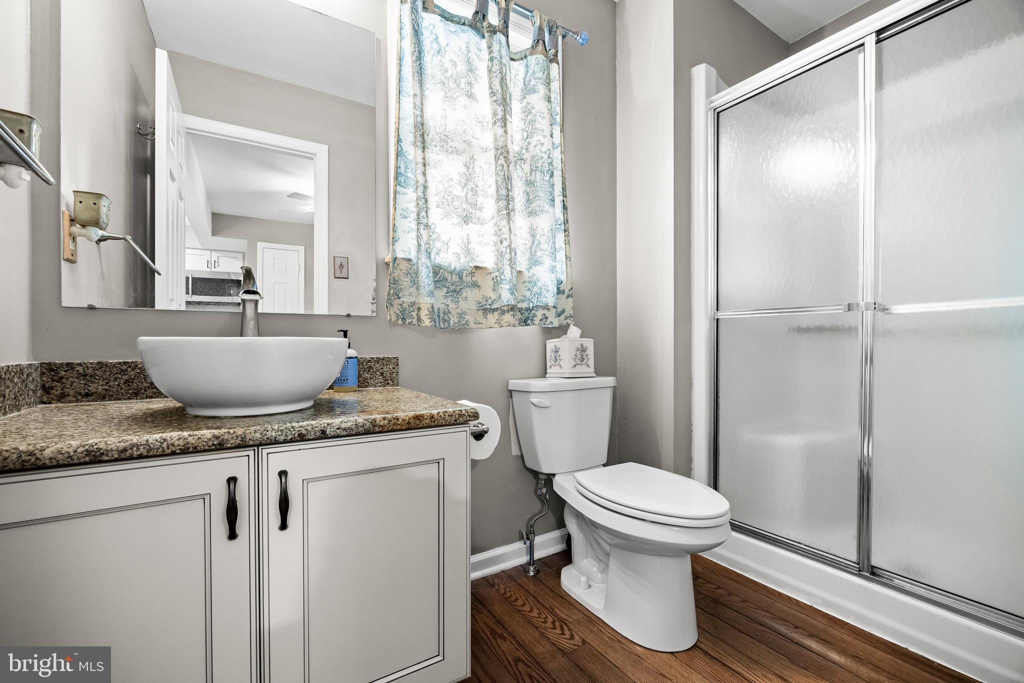 4 Mill Run Court Medford, NJ 08055 - Photo 39 of 53 a bathroom with a granite countertop sink a toilet a mirror and shower