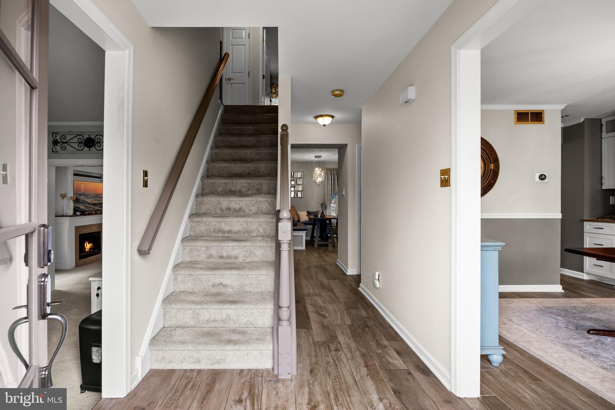 4 Mill Run Court Medford, NJ 08055 - Photo 4 of 53 a view of a hallway with wooden floor and staircase