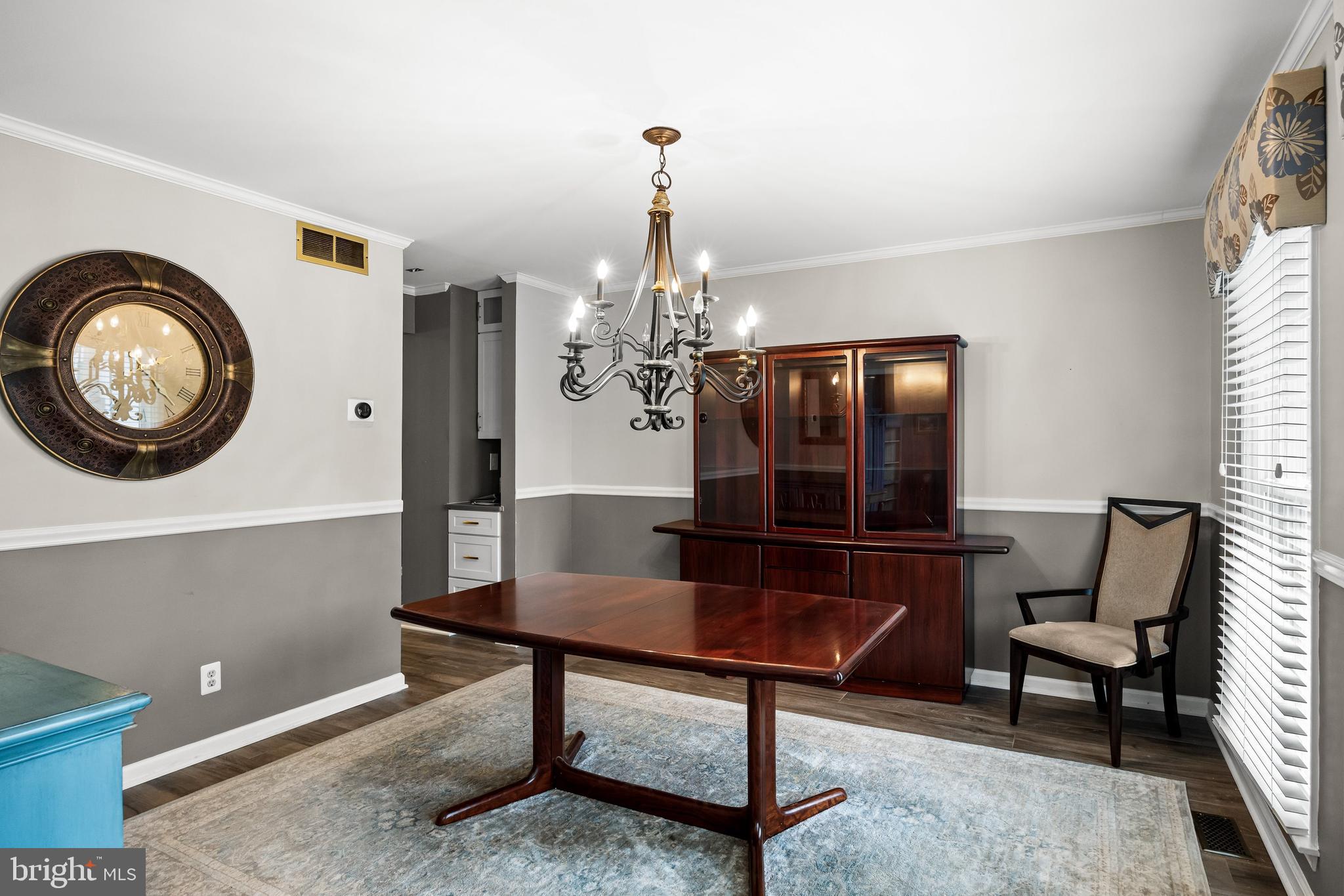 4 Mill Run Court Medford, NJ 08055 - Photo 8 of 53 a living room with furniture and a chandelier