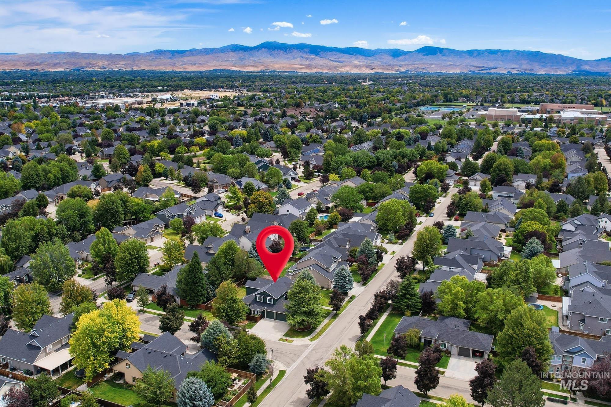 2172 West Cedar Grove Street Meridian, ID 83646 - Photo 42 of 49 Residential neighborhood with mature trees and a distant mountain range